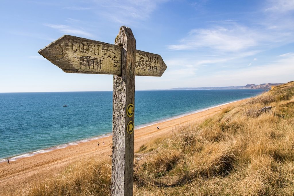 Coastal walking views along the South West Coast Path near Beaminster, West Bexington, West Bay, Seatown and Golden Cap, showing dramatic cliffs, sea views and countryside landscapes.