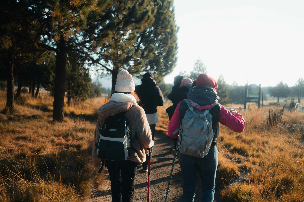 Women walking through the Dorset countryside near Beaminster on a scenic weekend break.